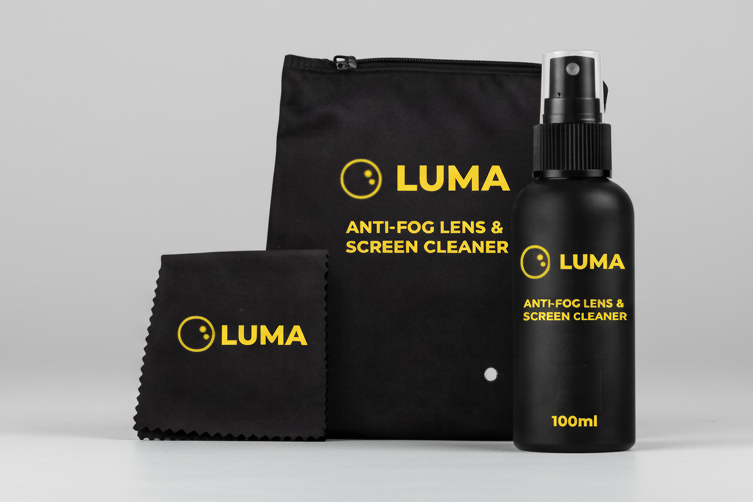 Luma anti-fog lens and screen cleaner set with spray bottle, cloth, and pouch on a white background