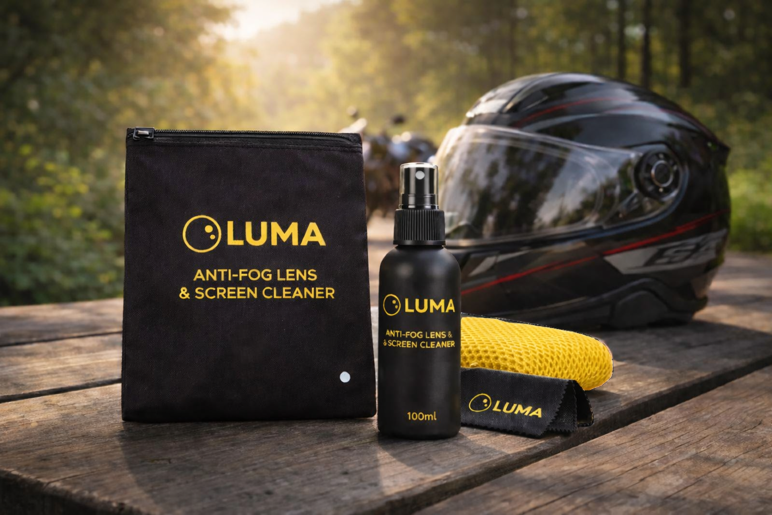 Luma anti-fog lens and screen cleaner set with a helmet on a wooden surface outdoors.